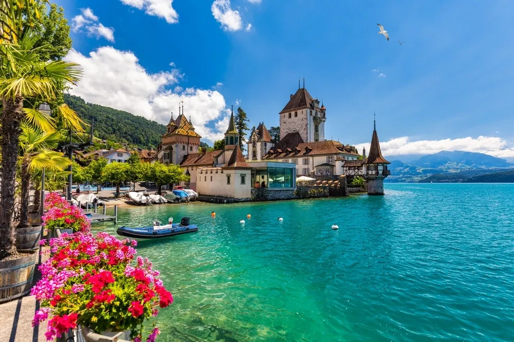 a stunning panoramic view of Zurich, Switzerland, capturing the Limmat River flowing through the heart of the historic city.
